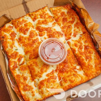 King Pizza House - a pizza in a cardboard box - Pizza Near Me - Calgary, Alberta