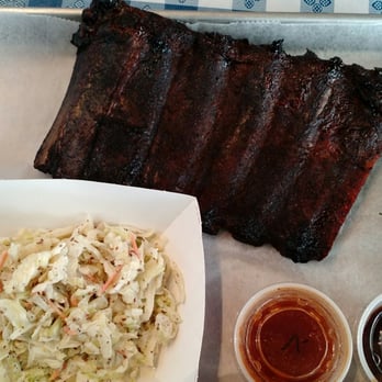 The Butcher's Smokehouse - Half slab St. Louis ribs with a side of coleslaw. - Smokehouse Near Me - Bloomington, Indiana The Butcher's Smokehouse - Half slab St. Louis ribs with a side of coleslaw. - Smokehouse Near Me - Bloomington, Indiana