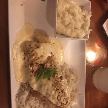 Wahoo Seafood Grill - Red fish with creamy almond crust topping. - Seafood Near Me - Gainesville, Florida Wahoo Seafood Grill - Red fish with creamy almond crust topping. - Seafood Near Me - Gainesville, Florida