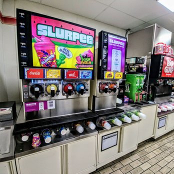 7-Eleven - a row of soda machines in a grocery store - Convenience Stores Near Me - Sarasota, Florida