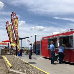 Hungry Hank's - It's a great day for a hot dog by the river! - outside - Food Trucks Near Me - Tonawanda, New York