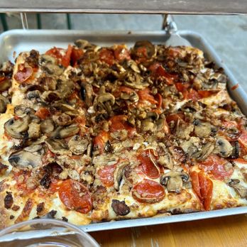 Adrienne's Pizzabar - Old fashioned pizza topped with pepperoni, sausage, and mushrooms - Pizza Near Me - New York, New York