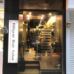 勤 - Store Front and price list on window.