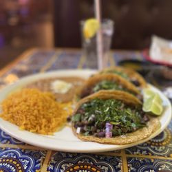 Cinco De Mayo - Asada, pastor and carnitas tacos, rice and beans.