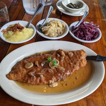 Edelweiss Restaurant - Schnitzel with German potato salad and cabbage sides (not sure why pork schnitzel is shaped like a fish). - German Near Me - Staunton, Virginia Edelweiss Restaurant - Schnitzel with German potato salad and cabbage sides (not sure why pork schnitzel is shaped like a fish). - German Near Me - Staunton, Virginia