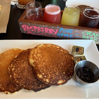 Stem & Stone - Sweet Cream Pancakes with blueberry and pan sausage. And the mimosa flight - New American Near Me - Bastrop, Texas Stem & Stone - Sweet Cream Pancakes with blueberry and pan sausage. And the mimosa flight - New American Near Me - Bastrop, Texas