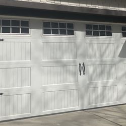 Paradise Garage Door's & Service By Kraus - Carriage style, steel insulated with double pane glass upgrade.