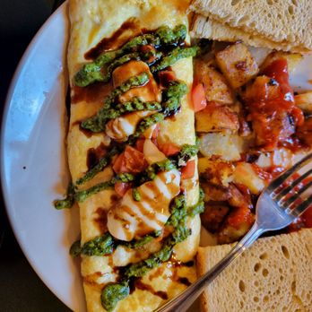 Fame Good Eats - A few bites into the Pesto omelet - Breakfast & Brunch Near Me - Morrisville, Pennsylvania Fame Good Eats - A few bites into the Pesto omelet - Breakfast & Brunch Near Me - Morrisville, Pennsylvania