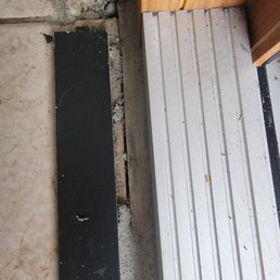 The door threshold was install above floor tiles. The door threshold was install above floor tiles.