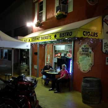 Ocala Wine Experience - a woman sitting at a table outside a restaurant - Beer, Wine & Spirits Near Me - Ocala, Florida