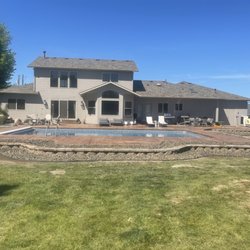 M & M Pools And More - Beautiful 20' x 40' completed with small retaining wall.