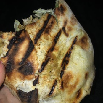 Donair Plus - a hand holding a piece of bread - Donairs Near Me - North Vancouver, British Columbia Donair Plus - a hand holding a piece of bread - Donairs Near Me - North Vancouver, British Columbia