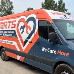 Harts Plumbers, Electricians, & HVAC Technicians - Side view of our newly wrapped Harts van with bold "We Care More"