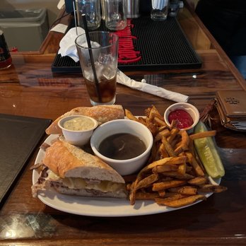 Poor Thom's Tavern - a plate of food on a table - Salad Near Me - Plainfield, New Hampshire