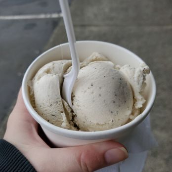 Murphy's Candy & Ice Cream - a hand holding a cup of ice cream - Ice Cream & Frozen Yogurt Near Me - Ocean Shores, Washington Murphy's Candy & Ice Cream - a hand holding a cup of ice cream - Ice Cream & Frozen Yogurt Near Me - Ocean Shores, Washington