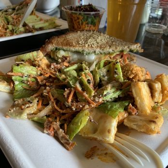 Fruits & Roots Juice Bar + Vegan Cafe - Split the Grilled Cheese & Buffalo Cauliflower Caesar w/ my wife and upgraded our side to a Root Salad - Vegan Near Me - Stuart, Florida Fruits & Roots Juice Bar + Vegan Cafe - Split the Grilled Cheese & Buffalo Cauliflower Caesar w/ my wife and upgraded our side to a Root Salad - Vegan Near Me - Stuart, Florida