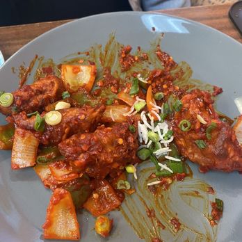 Cafe Everest - Momo's tossed in chili chicken sauce - Himalayan/Nepalese Near Me - Arlington, Texas