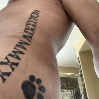 MD Tattoo Studio - The paw-print of our recently departed Westie 'Duncan' along with a series of important dates in Roman numerals - Tattoo Near Me - Thousand Oaks, California MD Tattoo Studio - The paw-print of our recently departed Westie 'Duncan' along with a series of important dates in Roman numerals - Tattoo Near Me - Thousand Oaks, California