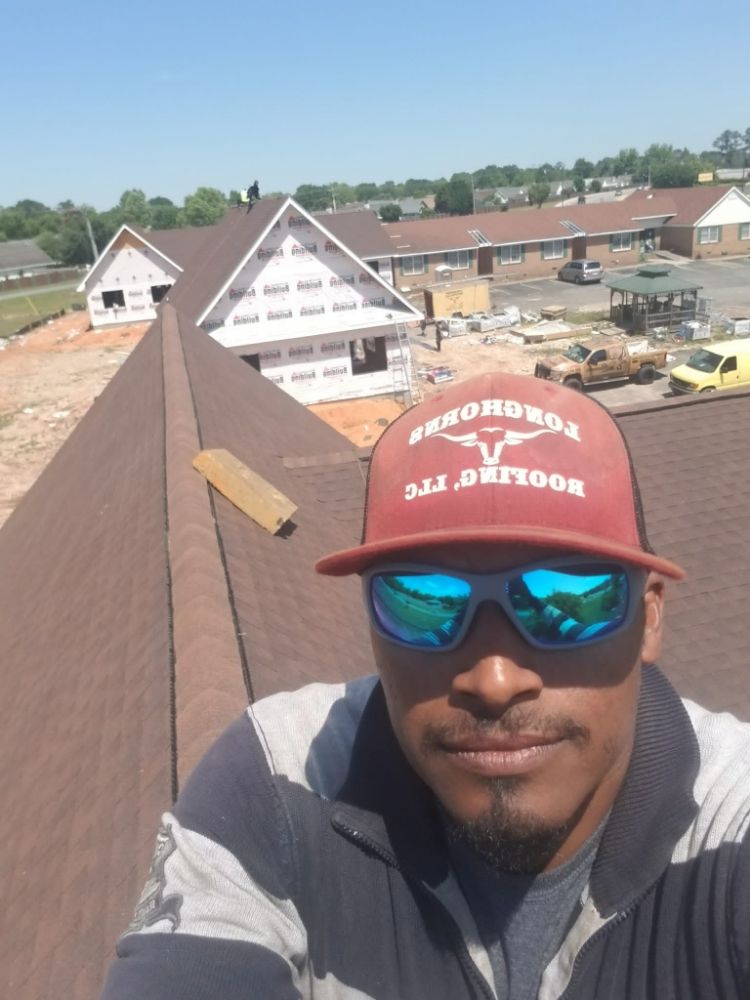 Slide of Longhorns Roofing