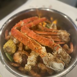 Red Crab Juicy Seafood - 1 lb King Crab, 1 lb of Snow Crab, 1 lb of be headed shrimp Potatoes and corn on a Cobb  Wednesday Special