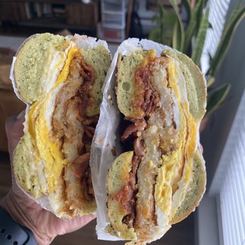 Proper Bagel - Gouda + Egg: Spinach Everything Bagel, Applewood Bacon, Fried Egg, Smoked Gouda Cheese, Add Hashbrown, Spicy Ketchup - Bagels Near Me - Nashville, Tennessee Proper Bagel - Gouda + Egg: Spinach Everything Bagel, Applewood Bacon, Fried Egg, Smoked Gouda Cheese, Add Hashbrown, Spicy Ketchup - Bagels Near Me - Nashville, Tennessee