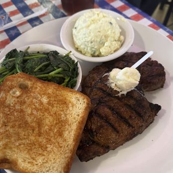 T-Bone Tom's - 14 oz. Ribeye with spinach, potato salad, and Texas toast - Barbeque Near Me - Kemah, Texas T-Bone Tom's - 14 oz. Ribeye with spinach, potato salad, and Texas toast - Barbeque Near Me - Kemah, Texas