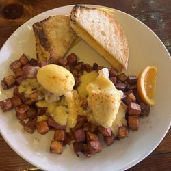Quinn's Tavern - Poached eggs, potato's, sourdough bread with beef! So savory and perfectly cooked!