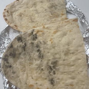 Manraj’s Kitchen - Naans with dark fingerprints dark spots - Indian Near Me - Auburn, Washington