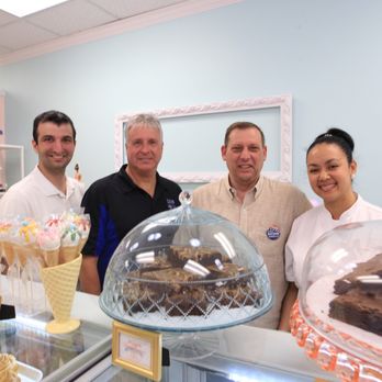 Nurys Cakes - a group of people standing in front of a counter - Custom Cakes Near Me - Bayonne, New Jersey Nurys Cakes - a group of people standing in front of a counter - Custom Cakes Near Me - Bayonne, New Jersey