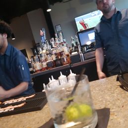 two men sitting at a bar two men sitting at a bar