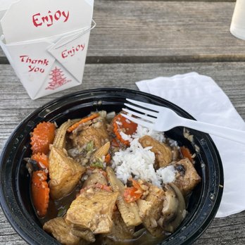 The Elephant - Geneva - a plate of food on a picnic table - Thai Near Me - Geneva, New York The Elephant - Geneva - a plate of food on a picnic table - Thai Near Me - Geneva, New York