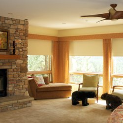 Durango Shade Company - Master bedroom motorized roller shades with fabric valance draperies.