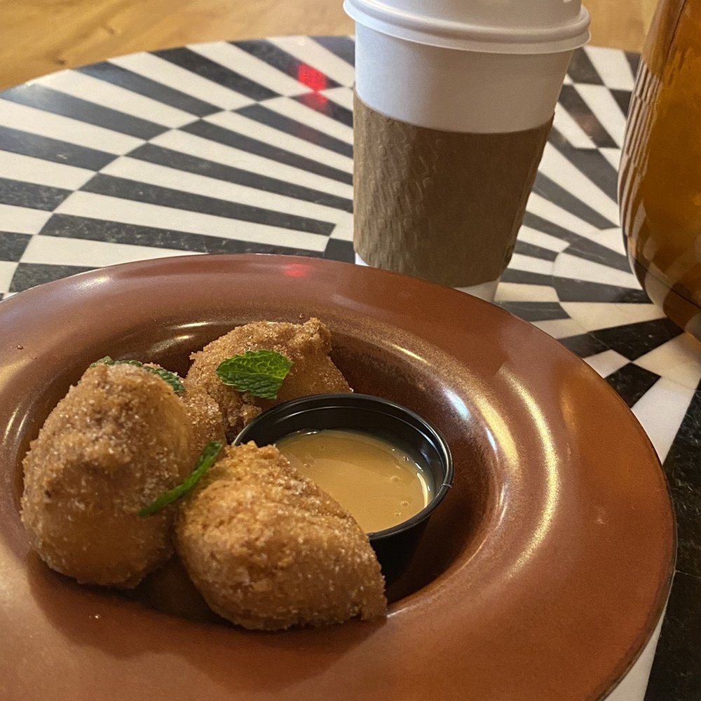 Funny Library - Churro fritters with caramel sauce, chai latte - Coffee & Tea Near Me - New Orleans, Louisiana Funny Library - Churro fritters with caramel sauce, chai latte - Coffee & Tea Near Me - New Orleans, Louisiana