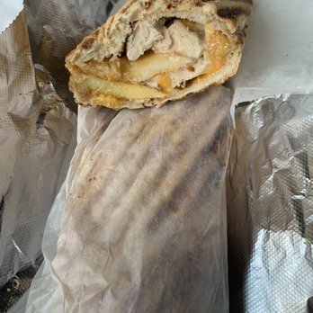 Panini Grill - a panini sandwich wrapped in aluminum foil - Sandwiches Near Me - New York, New York Panini Grill - a panini sandwich wrapped in aluminum foil - Sandwiches Near Me - New York, New York