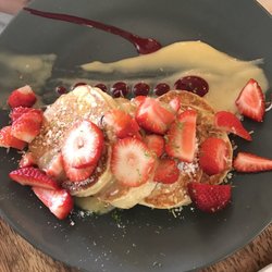 Caribou - Ricotta pancakes with lemon zest and strawberry coulis