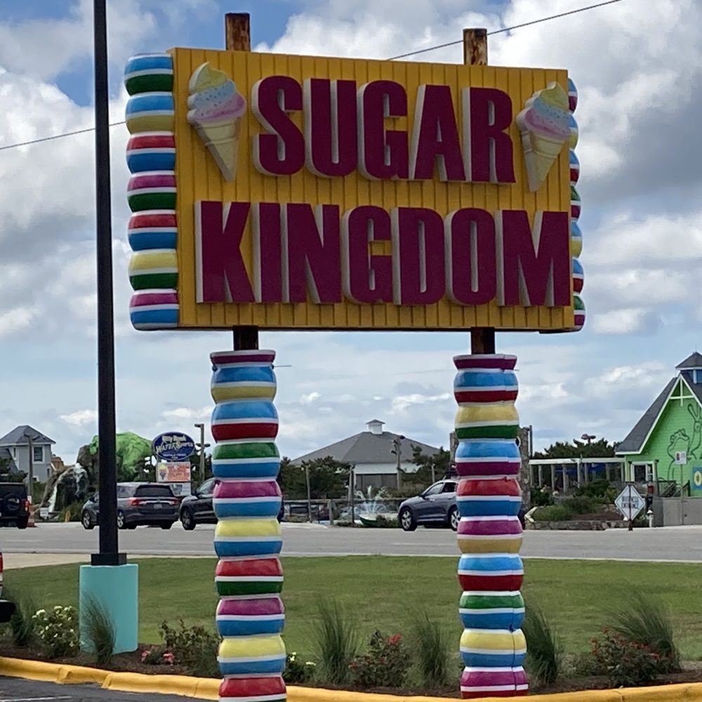 Sugar Kingdom - Look for this festive sign on northbound Hwy 158 (aka the bypass) around MP 16. - Candy Stores Near Me - Nags Head, North Carolina Sugar Kingdom - Look for this festive sign on northbound Hwy 158 (aka the bypass) around MP 16. - Candy Stores Near Me - Nags Head, North Carolina