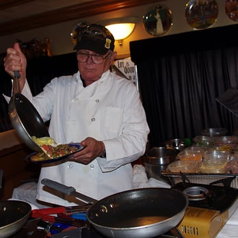 Bob's Train - Bob dishing up freshly made omelettes. - New American Near Me - Sarasota, Florida