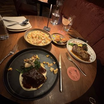 Posana - New york strip Diane, Braised short rib, Ricotta Gnocchi, Seared Scallops - New American Near Me - Asheville, North Carolina Posana - New york strip Diane, Braised short rib, Ricotta Gnocchi, Seared Scallops - New American Near Me - Asheville, North Carolina