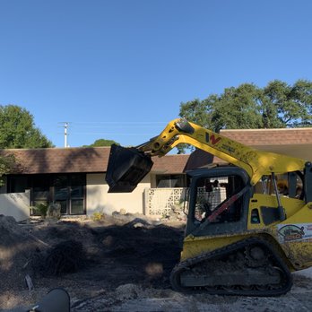 SRQ Grading - a construction vehicle in front of a house - Tree Services Near Me - Bradenton, Florida SRQ Grading - a construction vehicle in front of a house - Tree Services Near Me - Bradenton, Florida