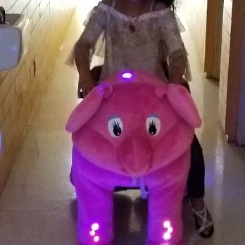 Plush On Wheels - Kids riding in the hallway. - Party Equipment Rentals Near Me Plush On Wheels - Kids riding in the hallway. - Party Equipment Rentals Near Me