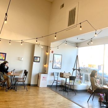 Coffee Hub - two people sitting at tables in a coffee shop - Coffee & Tea Near Me - Xenia, Ohio Coffee Hub - two people sitting at tables in a coffee shop - Coffee & Tea Near Me - Xenia, Ohio