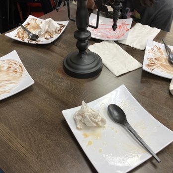 Vampire Penguin - a group of people sitting at a table with plates of food and utensils - Desserts Near Me - Brunswick, Georgia
