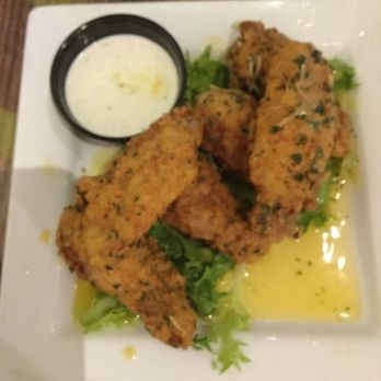 Georgia Blue - Appetizer of Garlic Wings!  Could've made this a meal!  These are the best wings I've ever had anywhere!!  I ate 2 prior to taking this pic! - American Near Me - Brookhaven, Mississippi