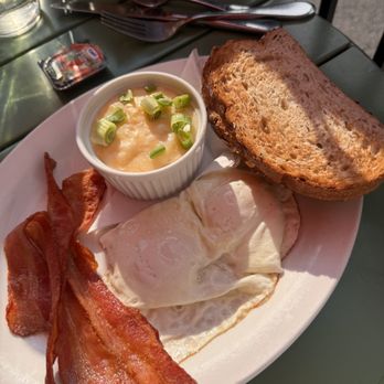 Tooloulous - Two eggs, toast, bacon, grits, and fruit - Cajun/Creole Near Me - Banff, Alberta