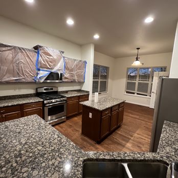 Juniors Hardwood Floors - a kitchen with granite countertops - Flooring Near Me Juniors Hardwood Floors - a kitchen with granite countertops - Flooring Near Me