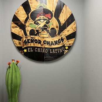 Senor Changs - a green cactus in front of a circular sign - Asian Fusion Near Me - San Angelo, Texas