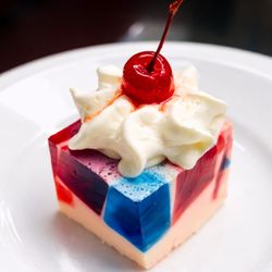 Wildomar Senior Assisted Living - All American cherry gelatin dessert by award-winning chef at Wildomar Senior Assisted Living, baked cake with fruit topping & whipped cream