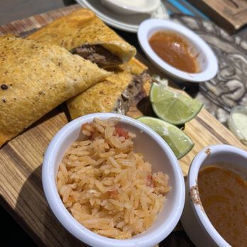 Los Mayas Mexican Grill - Quesabirria meal which came with rice. We also got cheese dip as an appetizer with the chips. - Mexican Near Me - Lyman, South Carolina Los Mayas Mexican Grill - Quesabirria meal which came with rice. We also got cheese dip as an appetizer with the chips. - Mexican Near Me - Lyman, South Carolina