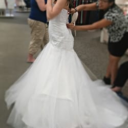 David's Bridal - My petite trumpet gown with beading, a sweet heart neckline, and a tulle skirt for $550.