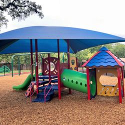 Shaded outdoor playground designed for children 2-5.